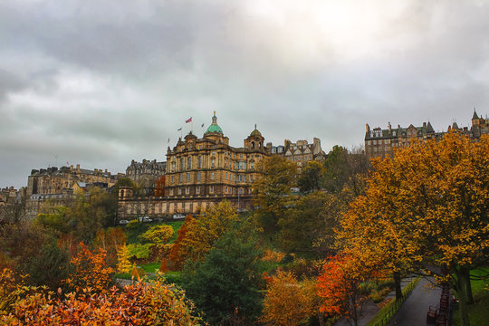 Gorgeous and colorful autumn or early winter's view of Edinburgh from Princes Street Garden with the sun popping out after a storm.