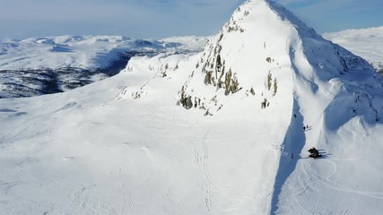 Atoklimpen, Sweden: Unidentified people, sunny winter day close to mountain in Lappland, Northern Sweden. Breathtaking view over Scandinavian Mountains