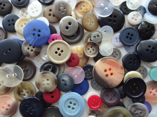 Various Sizes and Colors of Sewing Buttons (Background)
