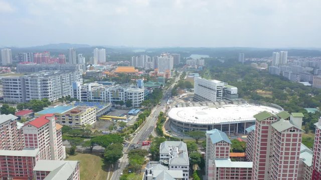 Aerial 4k footage of Public Housing Apartments of Singapore with Singapore skyline In Front Of A Nature Park In Singapore