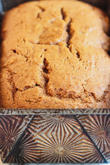 Abstract of extreme close up of fresh baked homemade pumpkin bread. Selective focus on foreground with blurred background.