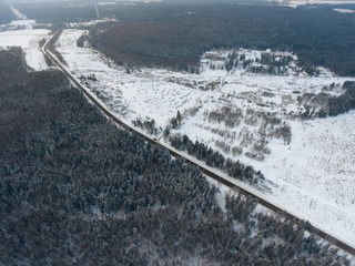 stunning panorama of the winter forest, conifers with snow, aerial view from a flying drone, shooting from a copter, Moscow Region, Russia