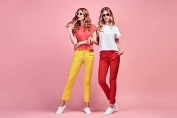 Two Fashion woman having fun, Trendy summer outfit
