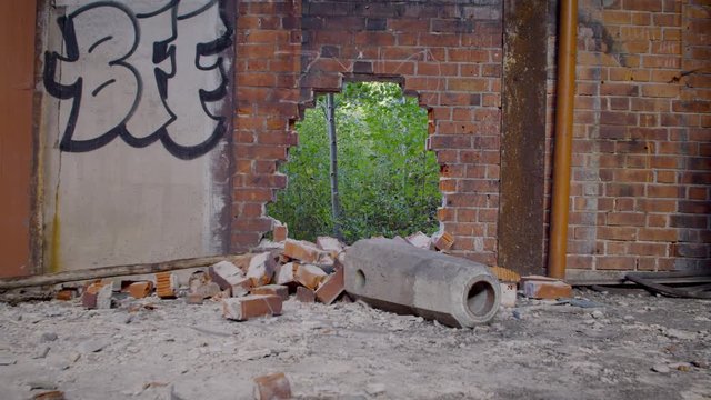 Hole Punched through Abandoned Factory Wall
