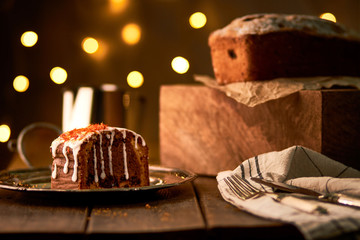 Tasty fruitcake in front of bokeh lights