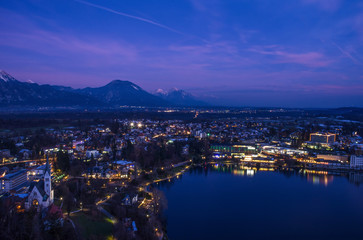 Naklejka premium View of the lake and the city of Bled, Julian Alps, Slovenia, by night.
