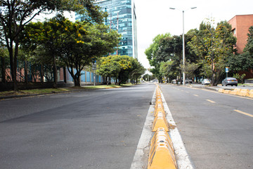 Modern city landscape carriageway next to a bike path named as 