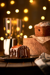 Tasty fruitcake in front of bokeh lights