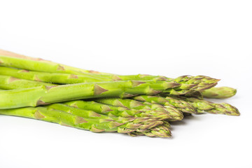 Fresh green asparagus on white