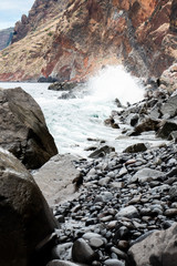 Ocean unchained on a pebble beach - Madeira, Portugal