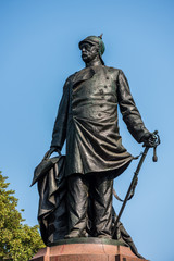 Fototapeta na wymiar Statue of historic Bismarck Memorial in the Tiergarten in Berlin, Germany. Prince Otto von Bismarck, the first Chancellor of the German Empire.