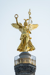 Close-up of golden angel satue and berlin Victory Column, a monument to commemorate the Prussian victory in the Danish-Prussian War and defeated Austria and Austro-Prussian War & France