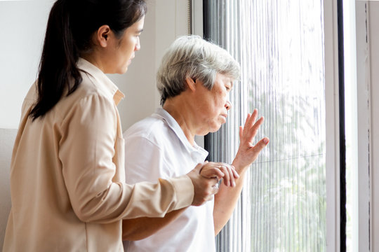 Asian Senior Woman Looking Through The Window In Bedroom,feeling Sad Depressed Elderly People Looking Away Outside Waiting For His Family To Visit At Nursing Home,facial Expression,life Depression,