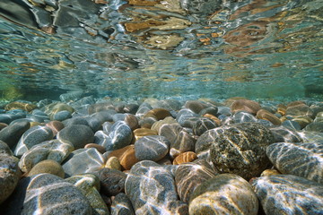 Pebbles stone under water surface natural scene - Powered by Adobe