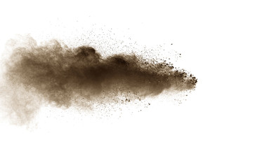 Fototapeta na wymiar Abstract deep brown dust explosion on white background. Freeze motion of coffee liked color dust splash.