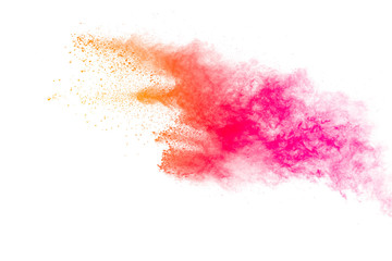 Colorful powder explosion on white background.Pastel color dust particle splashing.