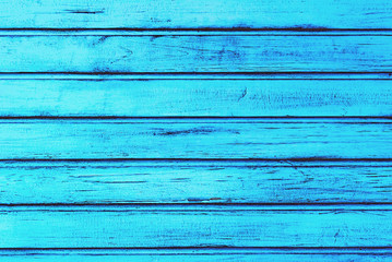 A fragment of a wooden wall painted in blue color,  aged and weathered. Best for wooden photophone