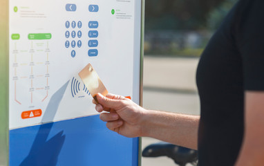 Man paying with contactless payment for bicycle