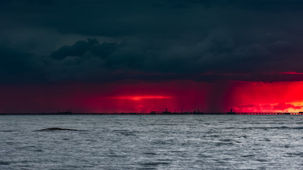 Fototapeta na wymiar Ominous fiery dawn on the sea