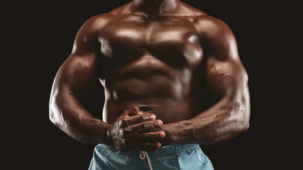 Fototapeta na wymiar Hot athletic body of african male bodybuilder
