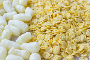 corn sticks and corn flakes close up.