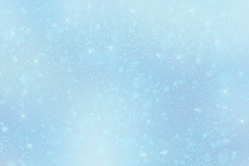 Tender blue winter background with snowflakes. New Year's atmosphere.