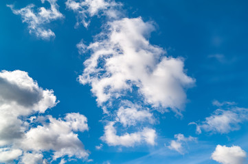 Naklejka na ściany i meble Contrasting lead clouds on a blue sky.