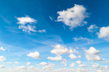 Contrasting autumn clouds against blue sky.