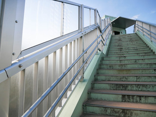 Landscape view of the stair up to overpass in Tyokyo City without any pedestrian in summer sunshine daytime 