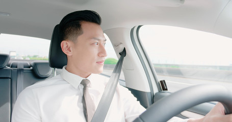 business asian man driving car