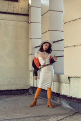 Stylish young girl in an autumn look