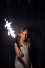 Little girl holding a sparkler