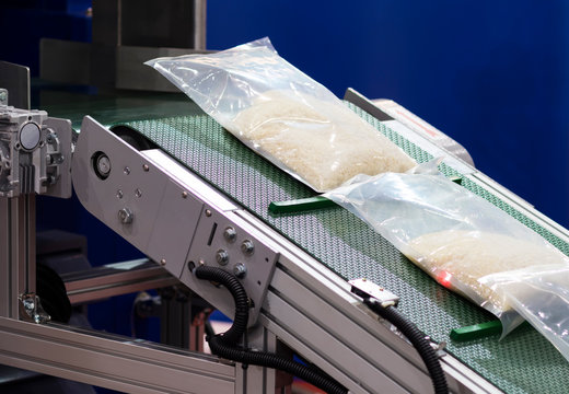 rice packing in plastic bag on conveyor line ;