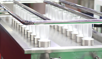 Glass  bottles in cleaning process  spraying by high pressure water