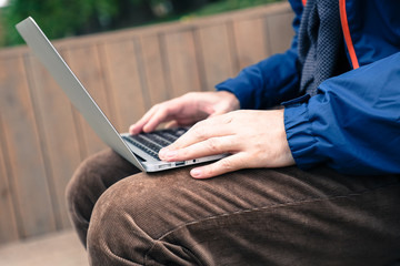 freelancer businessman working on laptop outdoors