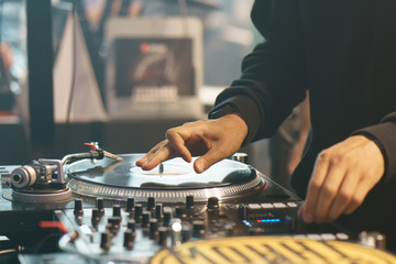 Photography of the modern premium stage mixed board / desk with vinyl turntable and vinyl plate....