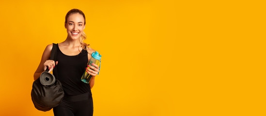Woman Holding Fitness Bag Ready For Training, Studio Shot, Panorama