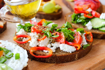 Useful sandwiches stuffed with avocado, scrambled eggs, cottage cheese and fruit