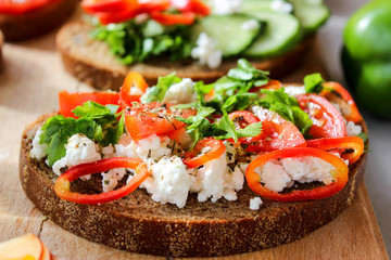 Useful sandwiches stuffed with avocado, scrambled eggs, cottage cheese and fruit