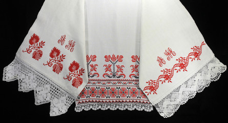 Three embroidered towels