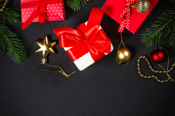 Christmas background with decorations on black.