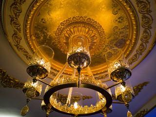 a antique chandelier with ornaments