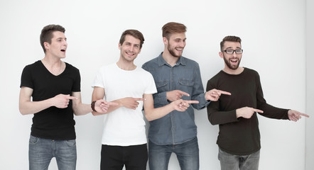 cheerful group of friends showing their fingers to the side