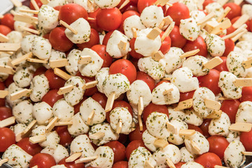 Garnished bowl with fruits, vegetables, cheese and meat at wedding reception..