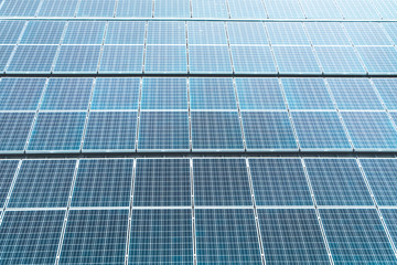 Aerial top view of a solar panels power plant. Renewable energy concept . Detailed close-up of modern large photovoltaic solar panels