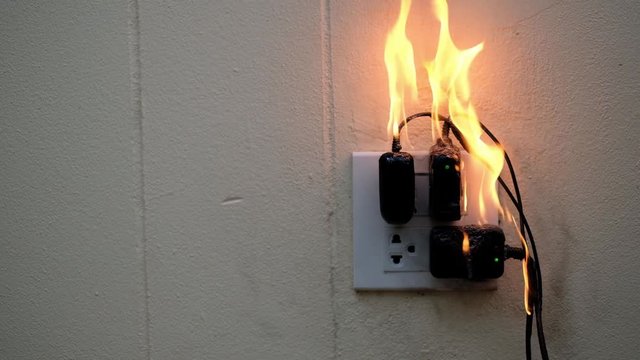 On fire adapter at plug Receptacle on white background