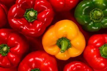 Fresh red, green, yellow bell pepper background.