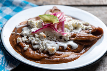 Mexican tacos with beans sauce and fresh cheese also called 