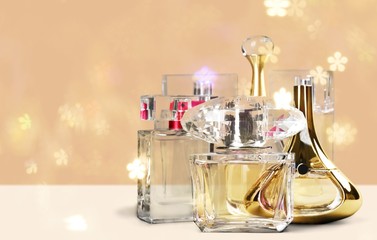 Aromatic Perfume bottles on background