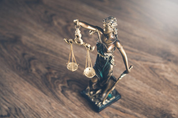 justice lady on the wooden desk background